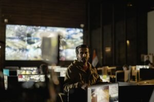 SIA CCTV Operators Course - Modern security control room with a diverse team monitoring live surveillance feeds.