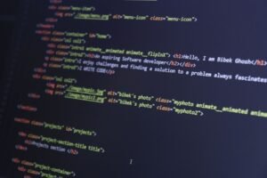 Website Development Foundations Certification - Colorful HTML code displayed on a computer screen for programming projects.