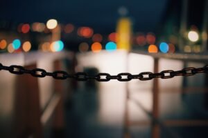 Introduction to Link Building for SEO Certification - Focused chain with a vibrant bokeh effect in the background, shot at night.