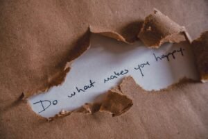 What Can You Trust Certification - Brown paper revealing message 'Do what makes you happy.'