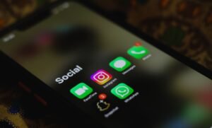 Social Media - A close-up shot of smartphone displaying social media apps icons on screen.