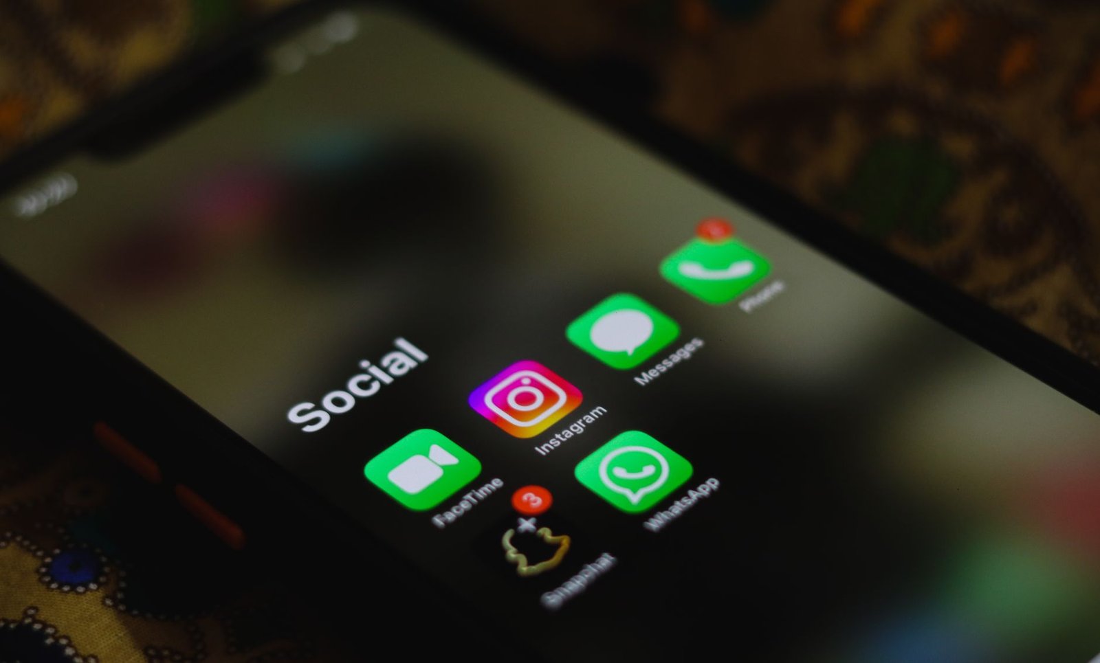 Social Media - A close-up shot of smartphone displaying social media apps icons on screen.