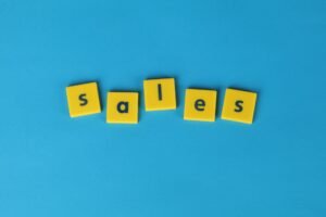 Converting Leads into Sales Certification - Yellow Scrabble tiles spelling 'sales' on a vibrant blue background. Perfect for marketing and business themes.