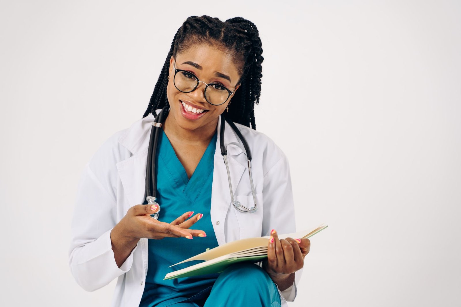 Speech Therapist Introduction Certification - Smiling female doctor in a white coat, holding documents and wearing eyeglasses, seated and engaged.