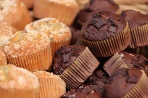 Cupcake Academy: Mini Course in Cupcakes and Muffins - Enticing close-up of chocolate and vanilla cupcakes showcasing their texture and ingredients.