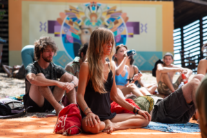 Meditation Certificate - Group of adults meditating outdoors during summer retreat. Relaxation and mindfulness theme.