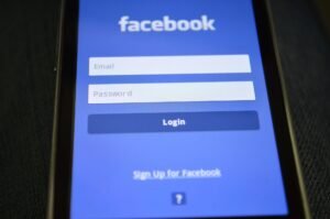 Perfect Password Creating Strong Password - Close-up of a smartphone screen showing the Facebook login interface.