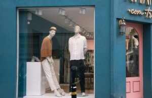 Visual Merchandising Certification - Mannequins showcasing stylish apparel in a boutique window display.