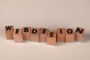 Create Your Own Website Certification - Wooden blocks spelling 'web design' creatively showcase digital design concept.