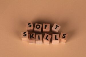 Essential Skills for First-Time Managers Certification - Wooden letter blocks spell out 'Soft Skills', highlighting business and personal development concepts.