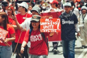 Preparing for the Employment Rights Act - Crowd of diverse protesters during a workers' rights demonstration in the city.