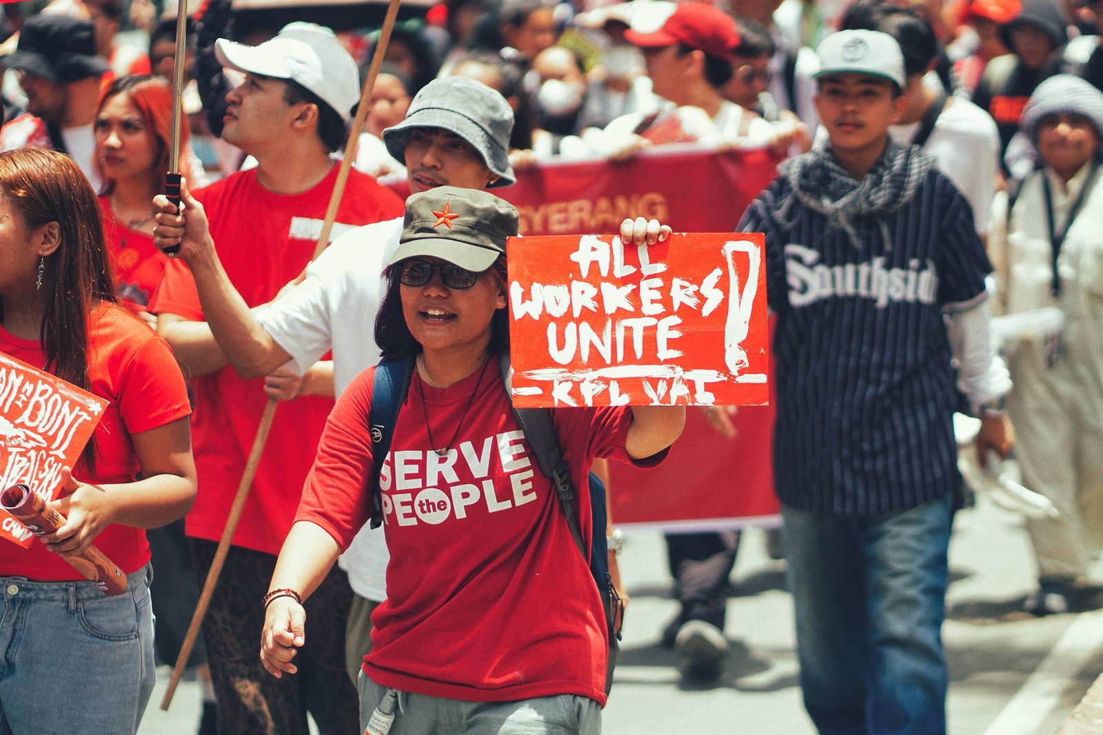 Preparing for the Employment Rights Act - Crowd of diverse protesters during a workers' rights demonstration in the city.