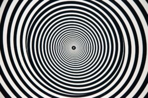 Hypnosis for Childbirth – Advanced Hypnotherapy Techniques Certificate - Hypnotic black and white concentric circles forming a captivating, optical illusion design.