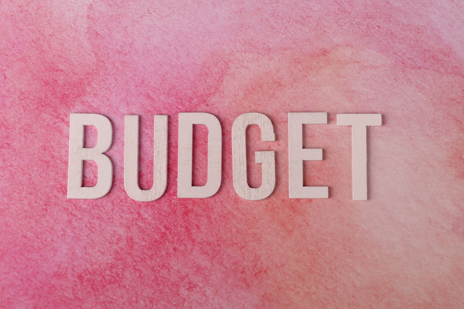 Budgeting Like a Boss Certification - The word 'BUDGET' on a pink textured background emphasizes financial planning.