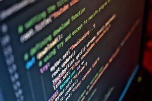 Coding Foundations Certification - Vivid close-up of code on a computer screen showcasing programming details.