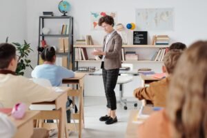 How to Become a Supply Teacher Certificate - Teacher conducting a classroom lesson with attentive students in a vibrant educational setting.