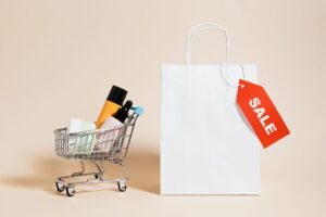 Product Pricing and Sales Negotiation Certification - Minimalist image featuring a shopping cart with products and a sale-tagged bag.