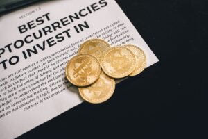 Cryptocurrency Certification - Close-up of Bitcoin coins on investment document promoting cryptocurrencies.
