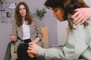Professional Addiction Counselling Certificate - Crop faceless male supporting pondering female with dark hair sharing problems with professional psychologist in daytime