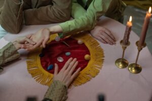 Palmistry Complete Guide to Palm Reading Certificate - Close-up of a fortune-telling session with crystals, candles, and palm reading.