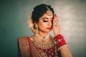 Bridal Makeup Certificate - Young ethnic female with bright makeup and black eyeliner in national costume closing eyes