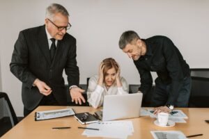 Dealing with Customer Complaints Certification - Three business professionals dealing with a stressful situation at work, highlighting workplace tensions.
