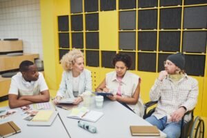Unconscious Bias Certification - Colleagues brainstorming and working together in a stylish office space, promoting teamwork.