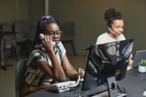 PA Telephone Skills Certification - Call center agents working in an office, focusing on customer service and communication.