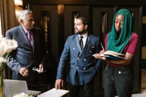 Becoming an Executive PA Certification - A culturally diverse team engaged in a serious business discussion in an office setting.