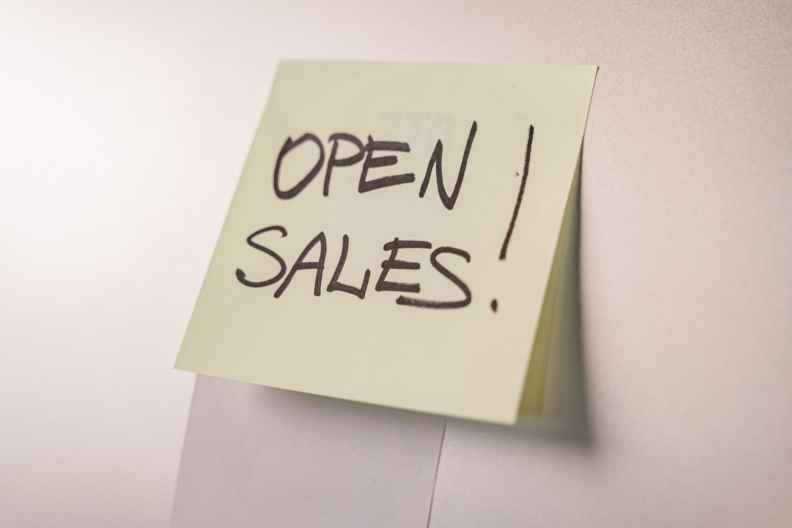 How to Close More Sales Certification - A close-up of an 'Open Sales' sticky note on a white background, ideal for business promotions.