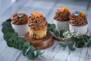 Cupcake Decorating – Animal Pack - Delightful cupcakes topped with chocolate icing and animal figures, perfect for parties.