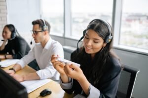 Call Centre Skills Certification - Diverse call center agents working collaboratively in a bright office environment.